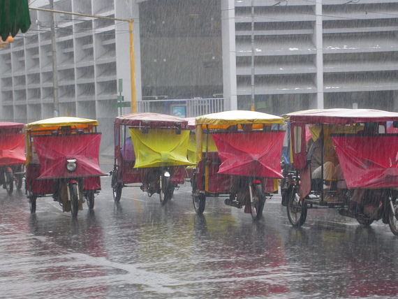 Iquitos in the rain with the motorcycle taxis 