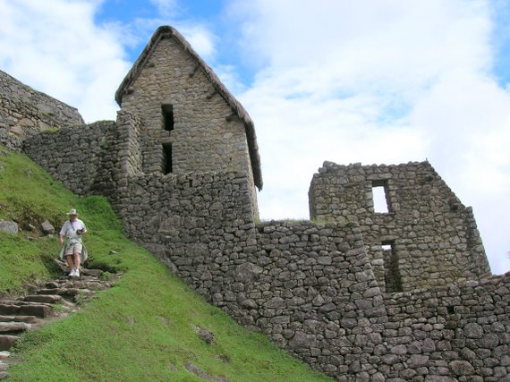 Machu Picchu, houses with two levels, the left with reconstructed roof