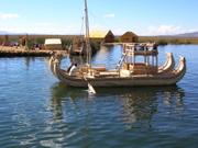 Lake Titicaca, a floating village of the Uros tribe, tourist bout build of rushes (totora:  Scirpus californicus)